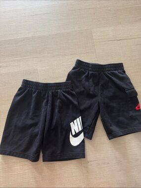 Nike Black Kids Athletic Shorts with White Logo and Red Swoosh
